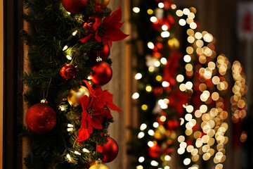 Red baubles poinsettias festive lights christmas decoration