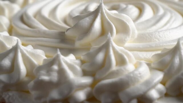 Close up of freshly whipped cream with textured surface ideal for culinary or dessert concepts copy space