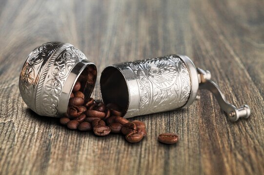 Old metal bowl with aroma coffee beens