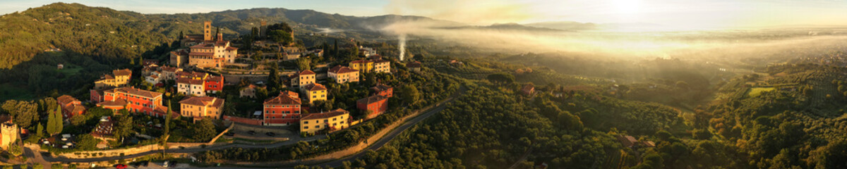 Italy, Idyllic small traditional towns of romantic Tuscany countryside. Picturesque borgo Buggiano hill top medieval village near Pienza. Panoramic view in morning loght