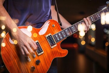 Fototapeta premium Photo of music acoustic guitar with lights