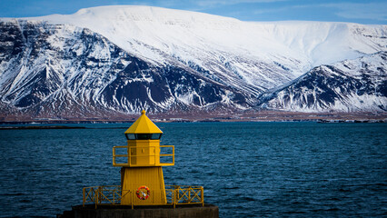 lighthouse on the shore of the sea