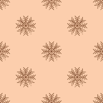 Seamless Christmas pattern. Grainy snowflake texture. Festive endless vintage print. New Years vector. For textile, wallpaper, wrapping design. Grunge brown snowflakes on peach background.