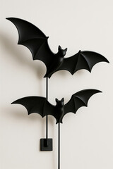 Black bat wall decorations on white background