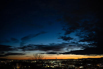 Nordic cityscape at twilight with dramatic evening sky