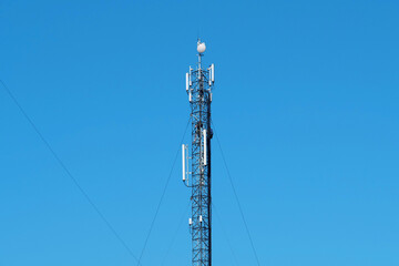 Maintenance staff at the work. High-altitude work. Worker repair cell tower