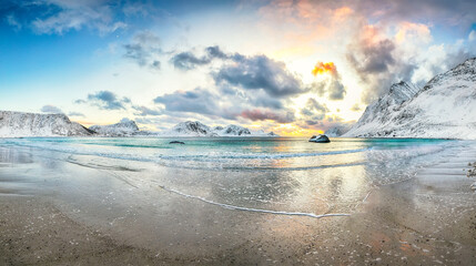 Stunning winter scenery with Haukland beach during sunset and snowy  mountain peaks near Leknes. © pilat666