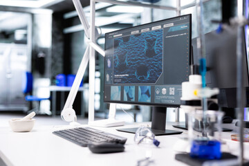 Computer showcasing molecular results in empty laboratory, scientific tools and research equipment for microbiology and biotechnology experiments. Advanced clinical testing in biolab.