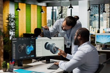 Team leader and coworker brainstorm to upgrade turbine, boosting power output and reducing carbon...