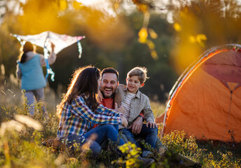 Dynamic family camping trip in the evening