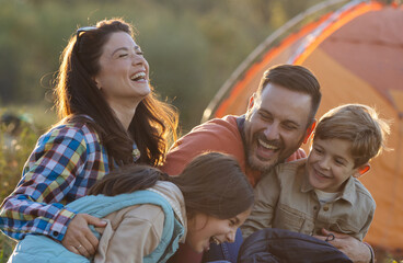 Portrait of happy family on camping trip