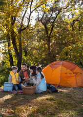 Family having lunch while camping