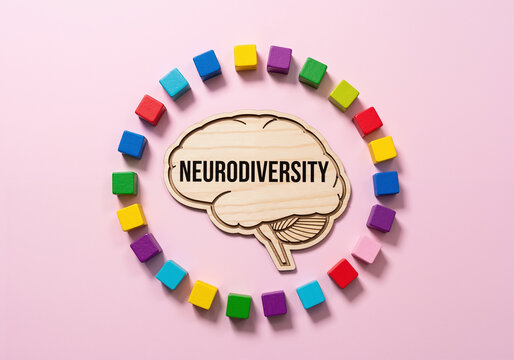 Neurodiversity concept with wooden brain and colorful blocks.