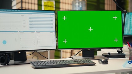 Empty company office features digital resources and mockup on monitor, workspace ready for report writing, strategy development and alignment of organizational goals achievement.