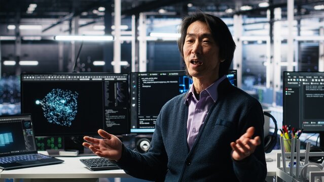 Smiling data center manager filming presentation, showcasing equipment using AI tech. Happy businessman presenting server room built for digital storage systems using artificial intelligence, camera A