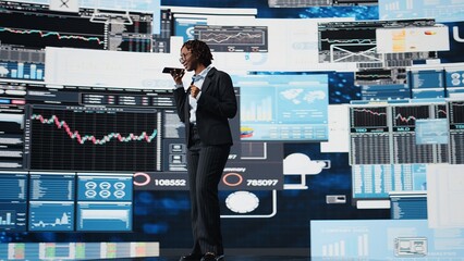 Businesswoman sharing voice note to coworker on phone, reviewing performance metrics. Manager using smartphone to send audio message to business partner, evaluating annual report data, camera A