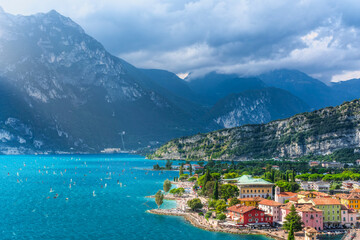 Fototapeta premium Torbole sul Garda Dramatic View, Town and Sailboats on Lake Garda, Italy