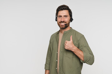Call center, portrait and Caucasian man with thumb up for telemarketing, crm support consulting isolated on a white studio background. Face, smile and sales agent with copy space for customer service