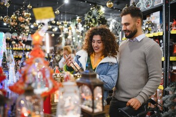 Couple shopping for christmas decorations and gifts