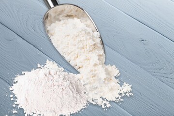 White wheat flour in metal scoop