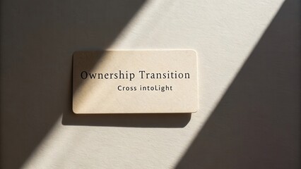 Inspirational signage on ownership transition for business guidance and personal development with light shadows