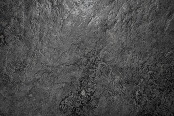dark gray stone texture background with natural rough surface details. Perfect for use in design, architecture, product mockups, or digital art as a realistic concrete or rock background.