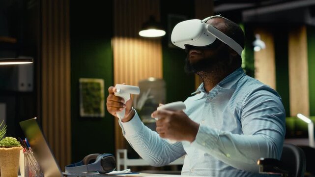 African american employee using AI tools with virtual reality late at night, working hard in the office with VR glasses to ensure fact checking and forecasting projections. Strategy room. Camera B.