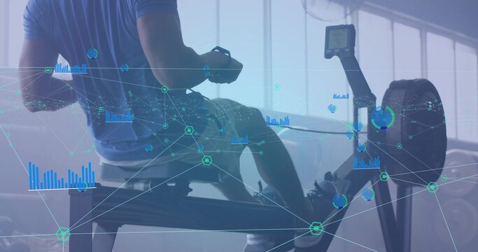 Rowing man in sportswear wearing fitness tracker on rowing machine in gym, with analytics overlays - Powered by Adobe