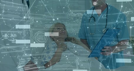 Healthcare provider in blue scrubs checking patient on hospital bed with digital overlay graphics