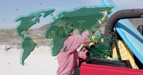 Leaning woman in pink shirt reaching into red convertible on dunes with surfboard, time zone map