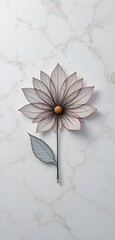 Elegant flower with intricate linework and delicate petals resting on a marble surface.