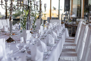 Elegant table setting for formal dining event in a modern restaurant during the evening