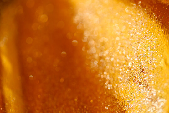  Festive background.Gold mockup with text space.Wallpaper phone shining glitter. Highlights on golden texture.Golden relief texture.Shimmering gold texture.Festive New Year and Christmas Wallpaper.  - Powered by Adobe