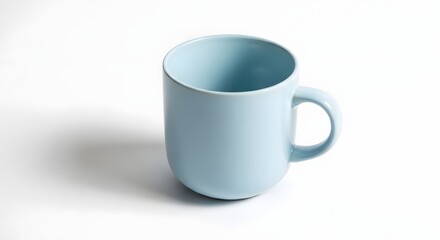 Fototapeta premium A light blue ceramic mug with a handle isolated on white background