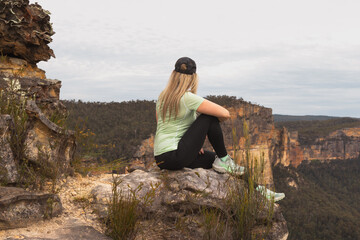 Woman relaxing on the cliffs in the Blue Mountains