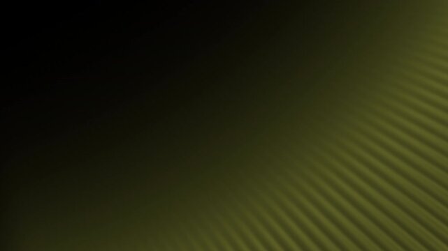 Smooth golden yellow abstract animation with diagonal light waves and gradient shading on dark background
