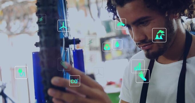 Mechanic rotating wheel revealing motor and eco icons inspecting battery pack and tightening bolt
