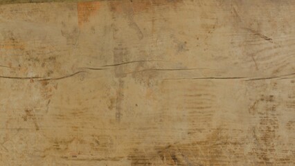 close up of textured aged wooden surface with natural cracks and faded marks