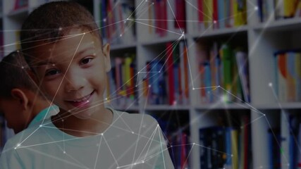 Front boy noticing book lifting gaze toward camera while network overlay promoting digital learning - Powered by Adobe