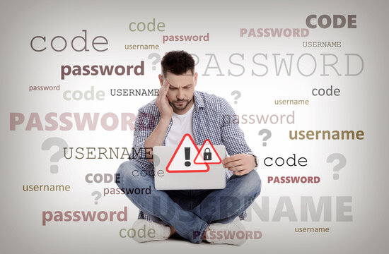 Troubled man with laptop trying to remember password and username. Light background with words