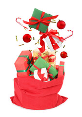 Christmas balls, gift boxes, candy canes and confetti falling into red bag on white background