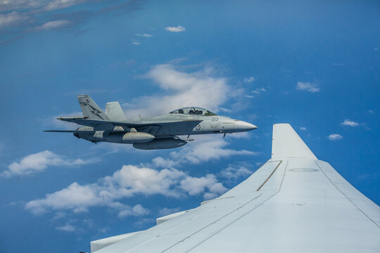 Australia RAAF FA18 Super Hornet fliying at altitude approaching a RAAF refeuler at close quarters