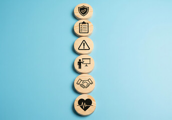 Wooden blocks with icons representing cloud computing documents security and data storage arranged in a row on a blue background