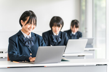 Elementary school, junior high school, and high school students taking classes on tablets and digital computers (ICT education, e-learning)
