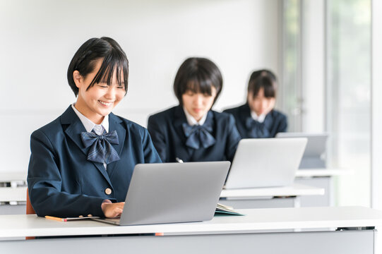 Elementary school, junior high school, and high school students taking classes on tablets and digital computers (ICT education, e-learning)
 - Powered by Adobe
