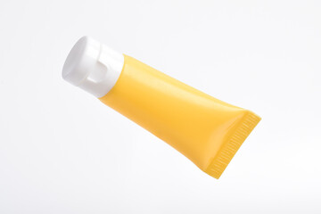 Blank packaging cosmetic plastic tube on white background