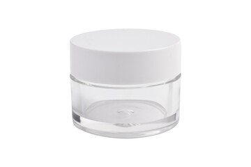 Clear glass cosmetic jar with white lid isolated on white background