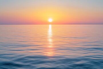 Obraz premium Calm Ocean Ripples Reflecting Sunrise Light with Sky Gradient and Shimmering Water