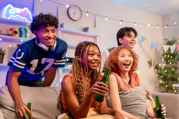 Group of diverse Generation Z friends enjoying a party in a cozy house.
