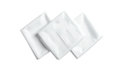 Three neatly folded white cloths, stacked and slightly overlapping, against a dark background